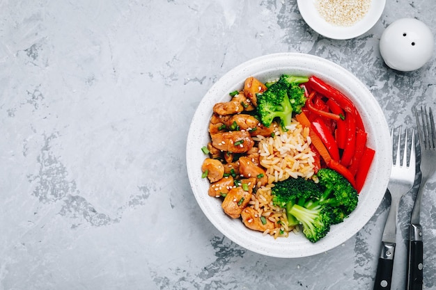 Teriyaki Chicken buddha bowl lunch with rice broccoli carrots and red bell pepper