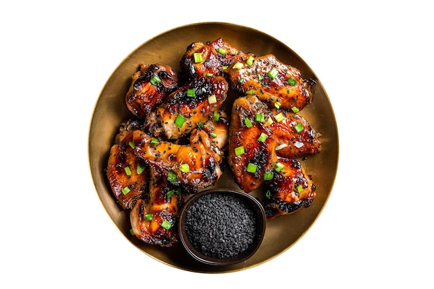 Teriyaki chicken wings with black sesame in a plate Isolated on white background