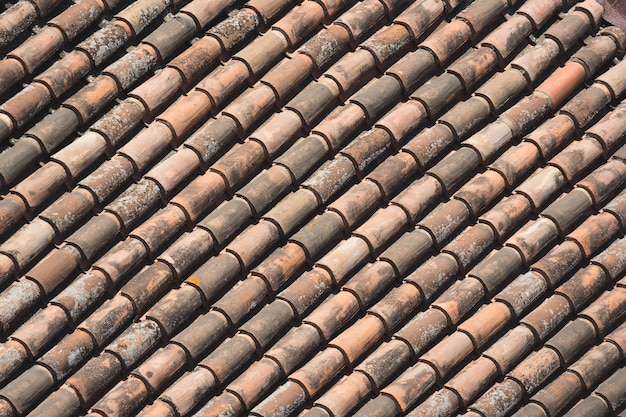 Terracotta roof tiles forming a diagonal pattern