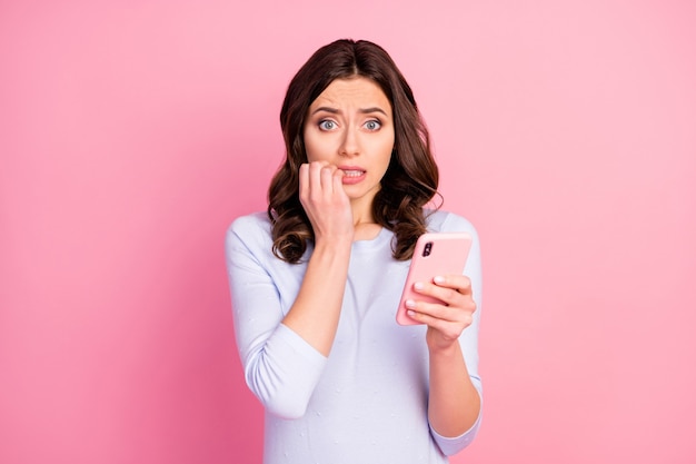 terrified lady hold telephone bite fingers