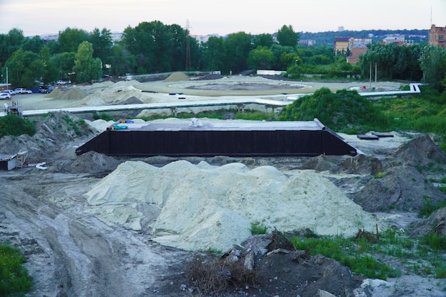 The territory of the construction site with materials and special equipment