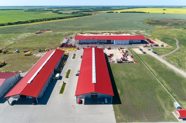 The territory of an industrial plant Large hangars with a red roof