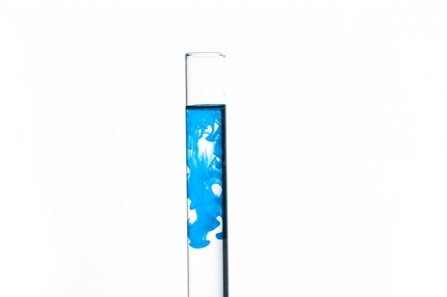 Test tube of water with blue paint