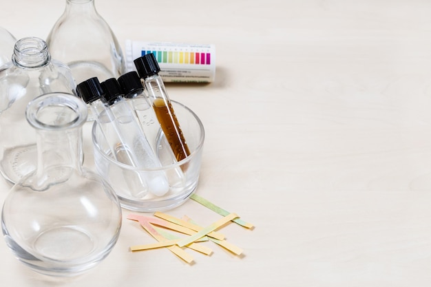 Test tubes with various liquids flasks on table