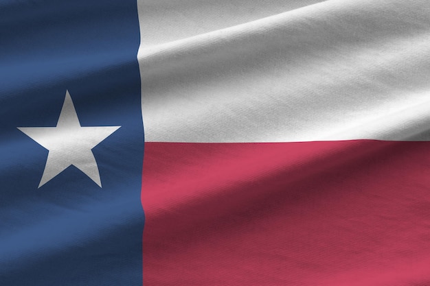 Texas US state flag with big folds waving close up under the studio light indoors The official symbols and colors in banner