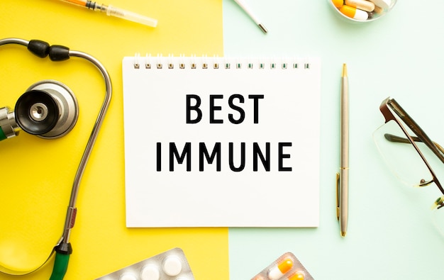 Text BEST IMMUNE on notebook with stethoscope