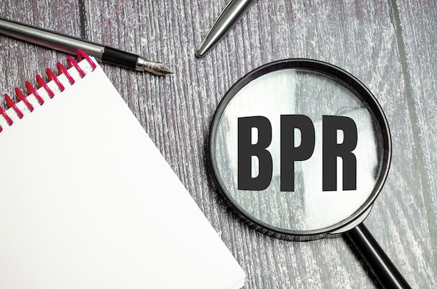 Text BPR written on the magnifier and pen