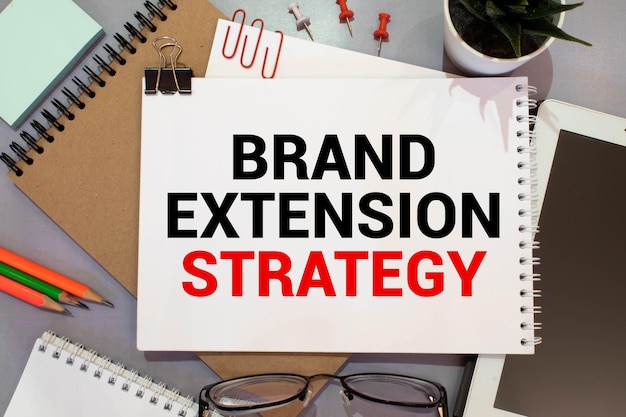 Photo text brand extension strategy on white paper