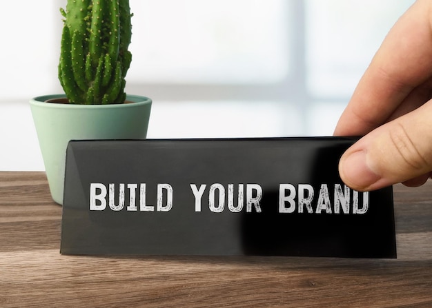 Text Build Your Brand writen on black table card