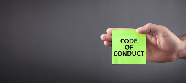 Text Code Of Conduct on sticky note