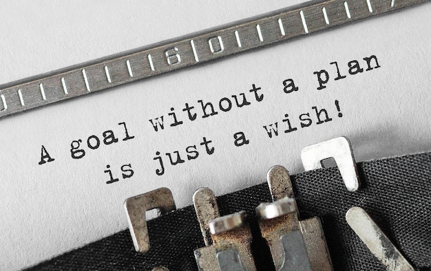 Text A goal without a plan is just a wish typed on retro typewriter