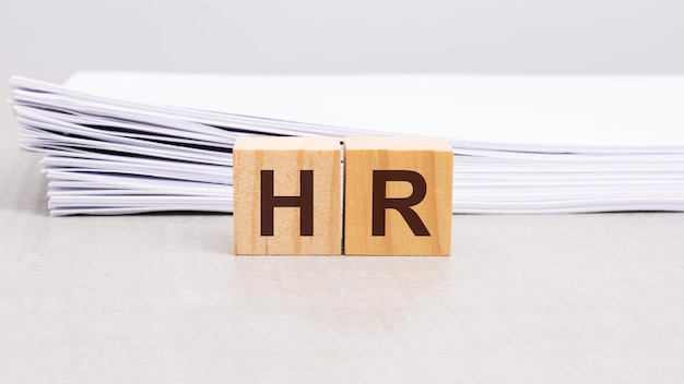 Text HR on wooden cube block human resource concept