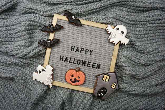 The text is written in the frame - Happy Halloween and there are gingerbread cookies