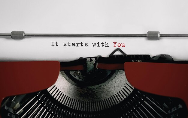 Text It starts with You typed on retro typewriter