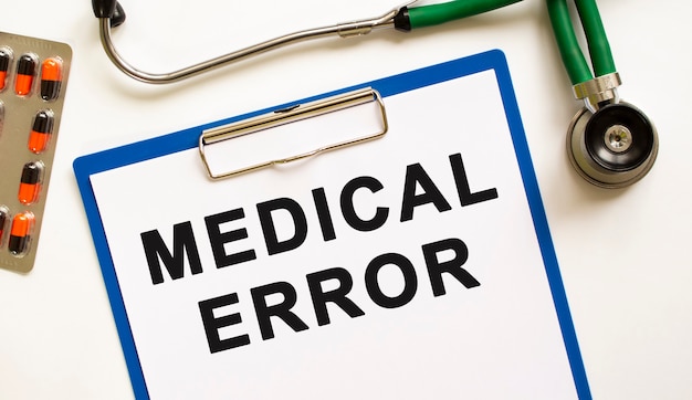 Text MEDICAL ERROR in the folder with the stethoscope