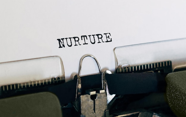 Text NURTURE typed on retro typewriter