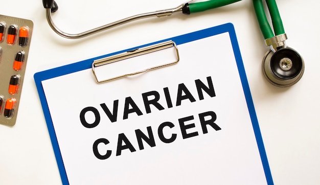 Text OVARIAN CANCER in the folder with the stethoscope.