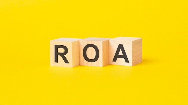 Text roa on wood blocks yellow background