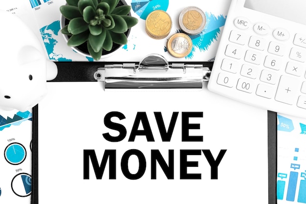 Text SAVE MONEY on clipboard. Calculator, piggy, coin, charts and graphs. Business layout.