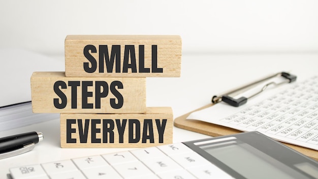 Text small steps everyday on a white background