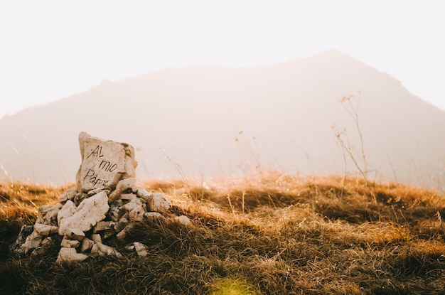 Photo text on tombstone at mountain