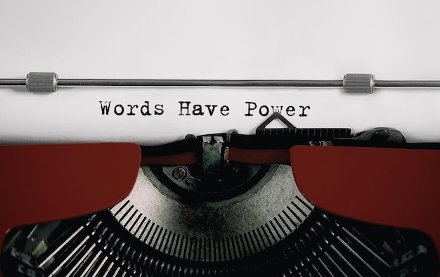 Text Words Have Power typed on retro typewriter