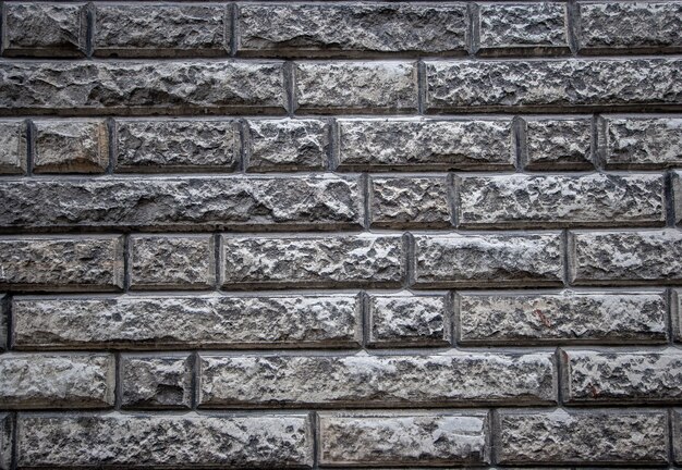 Textural background of an old stone wall made of limestone