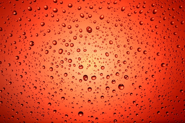 Texture and background of drops of water on a colored background