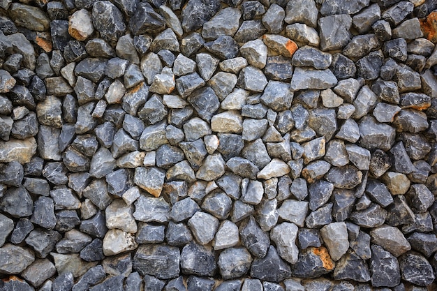 Texture and background of granite stone wall.