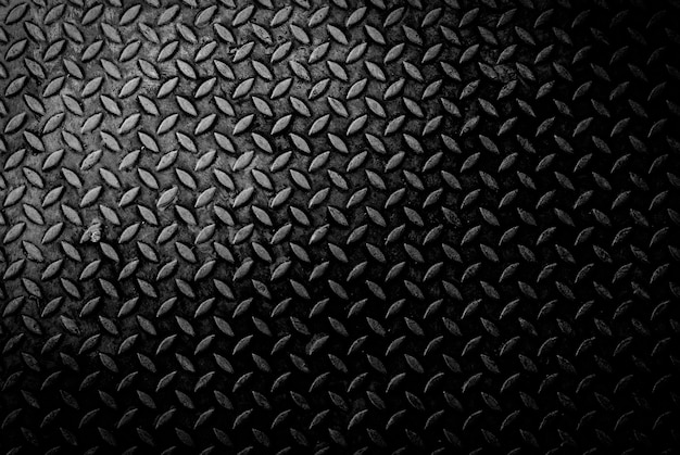 texture background of grungry old weathered  metal diamond plate with scratch and dirty in dark tone