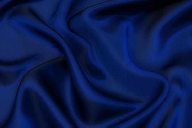 Texture, background, pattern. Texture of blue silk or cotton or wool fabric. Beautiful pattern of fabric