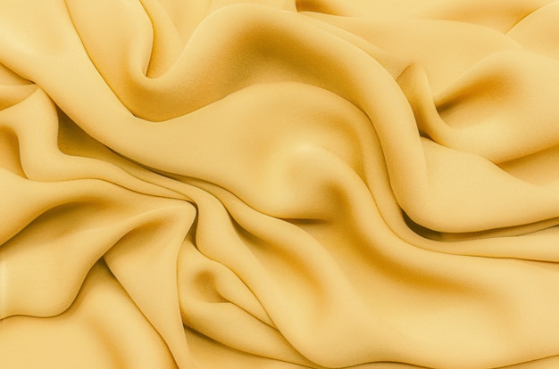 Texture background pattern Texture of yellow or golden silk or cotton or wool fabric