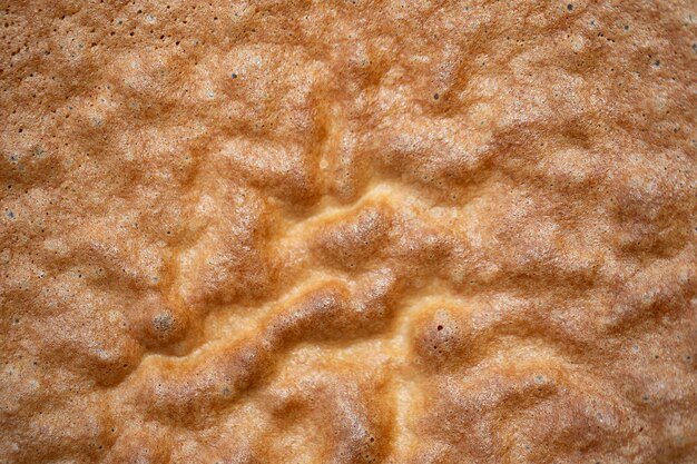 Photo texture of baked biscuit closeup the surface of the baked dough