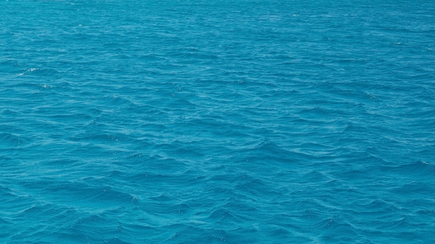 The texture of the beautiful light blue sea