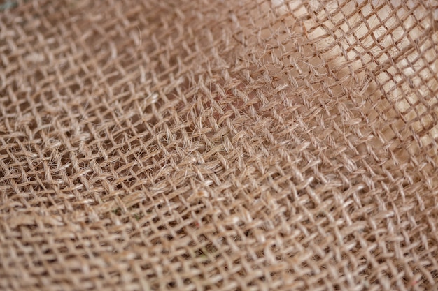 Texture of beige brown canvas fabric close-up background