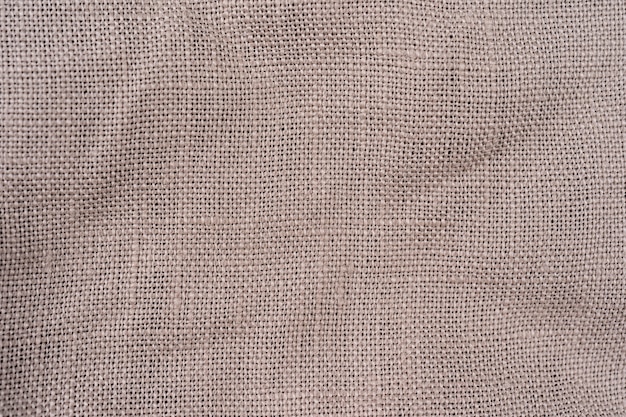 texture beige cotton textile background detailed closeup, rustic crumpled textured fabric burlap