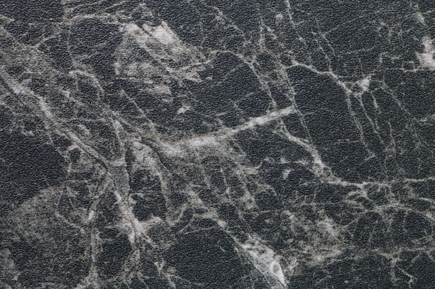 Texture of black marble with white lines