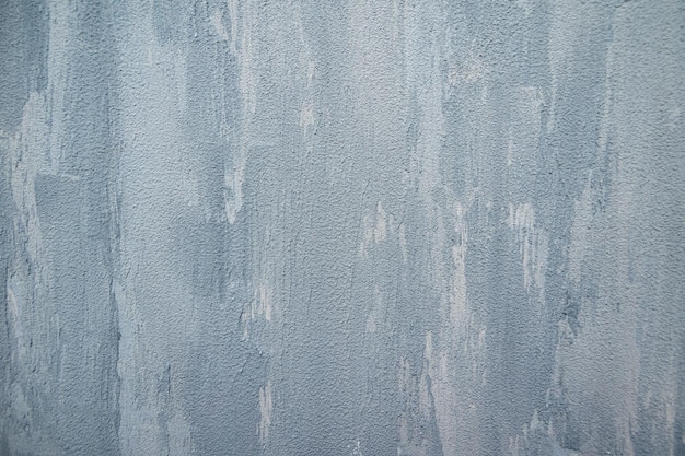 Texture blue gray plastered wall for background. Texture of a gray concrete wall. Rough painted concrete wall texture.