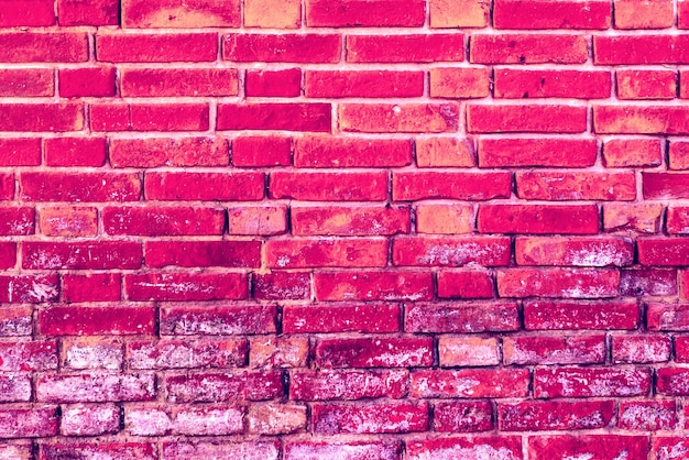 Texture of a brick wall with cracks and scratches which can be used as a background