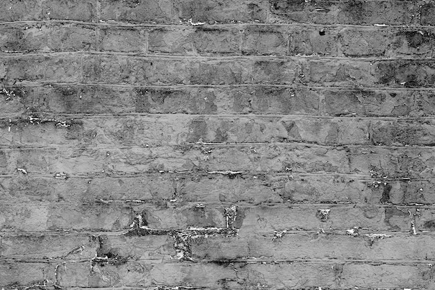 Texture of a brick wall with cracks and scratches which can be used as a background