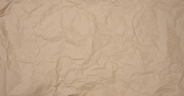 Texture of brown crumpled craft paper full frame