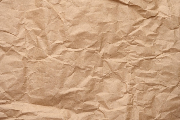 Texture of brown crumpled craft paper full frame