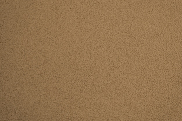 Texture of brown non-uniform fleece cotton fabric