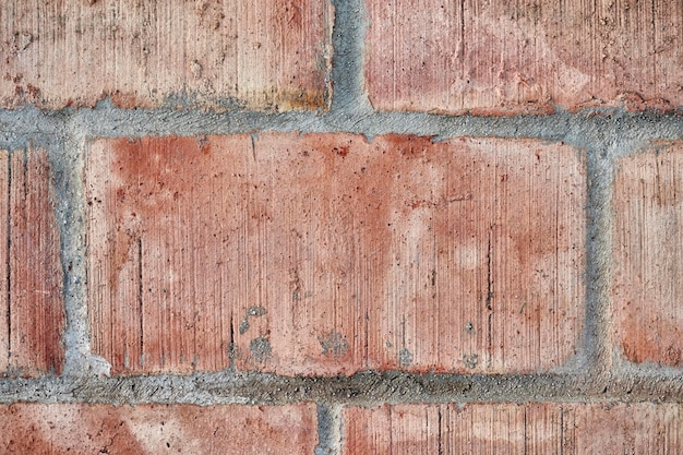 Texture of a cement wall of orange color joined with cement