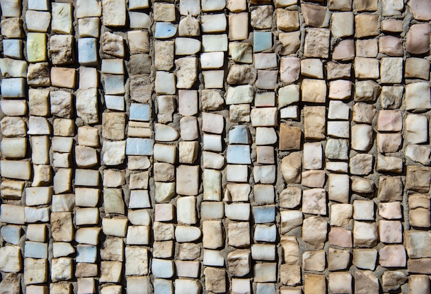 Texture of colored stone mosaic on the wall