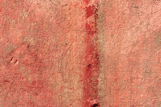 Texture of a concrete wall with cracks and scratches which can be used as a background