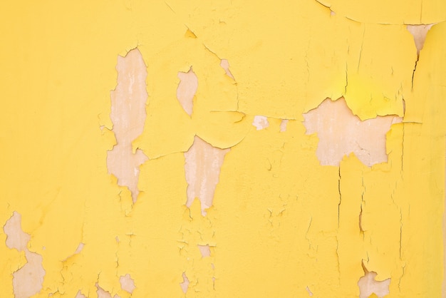 Texture of cracked yellow wall