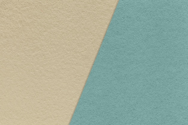 Texture of craft beige and blue paper background half two colors Vintage brown and cerulean cardboard