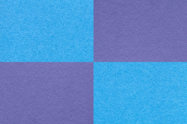 Texture of craft blue and violet paper background with cells pattern macro Vintage kraft turquoise cardboard