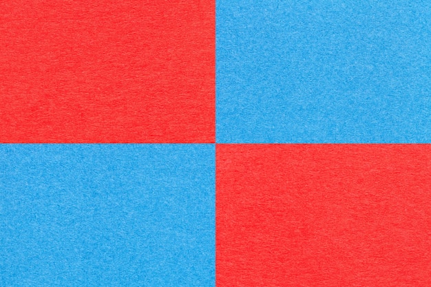 Texture of craft bright red and blue paper background with cells pattern Structure of vintage kraft cerulean cardboard